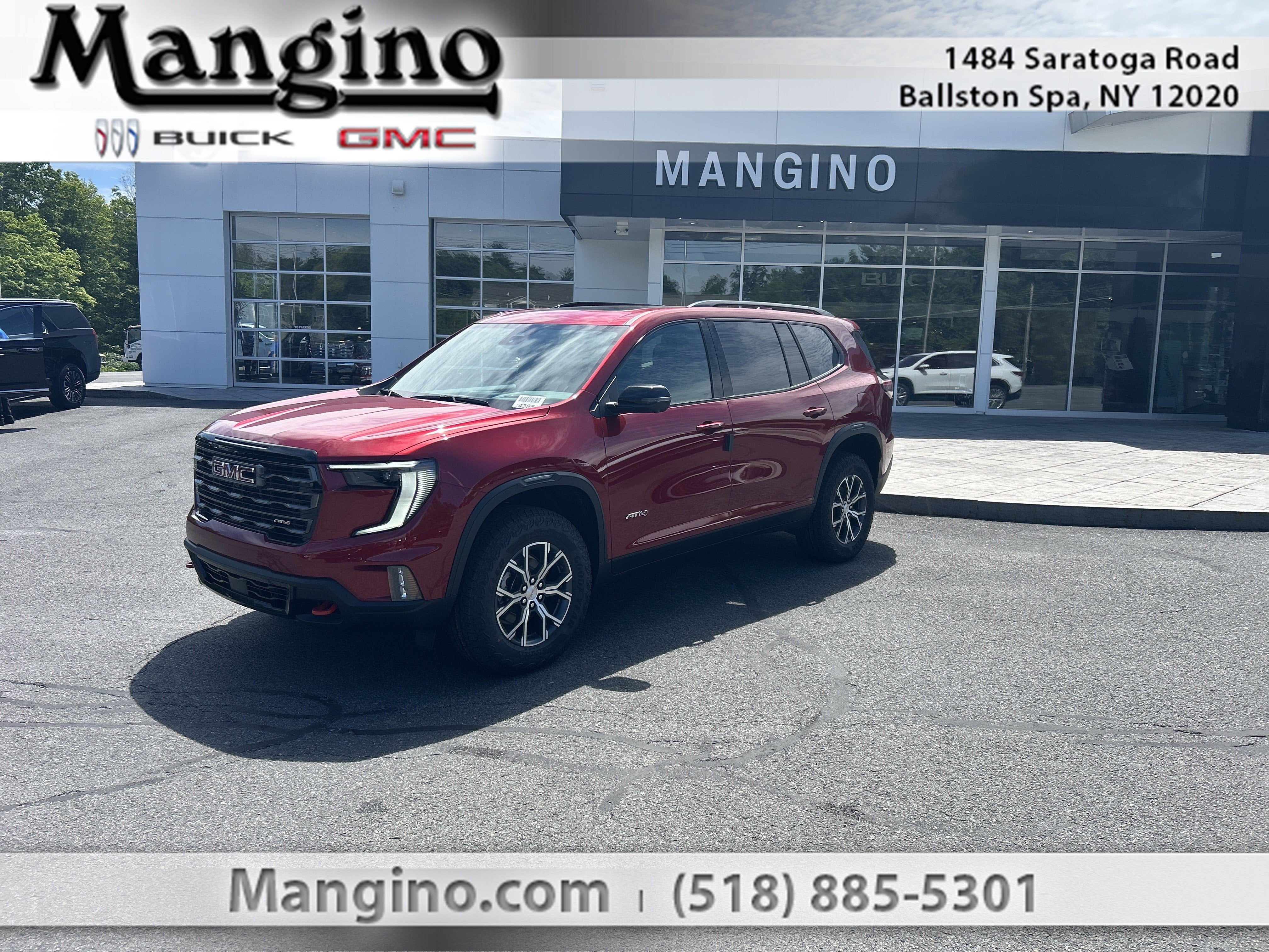 2026 GMC Acadia AT4 in Volcanic Red Tintcoat — front three-quarter view