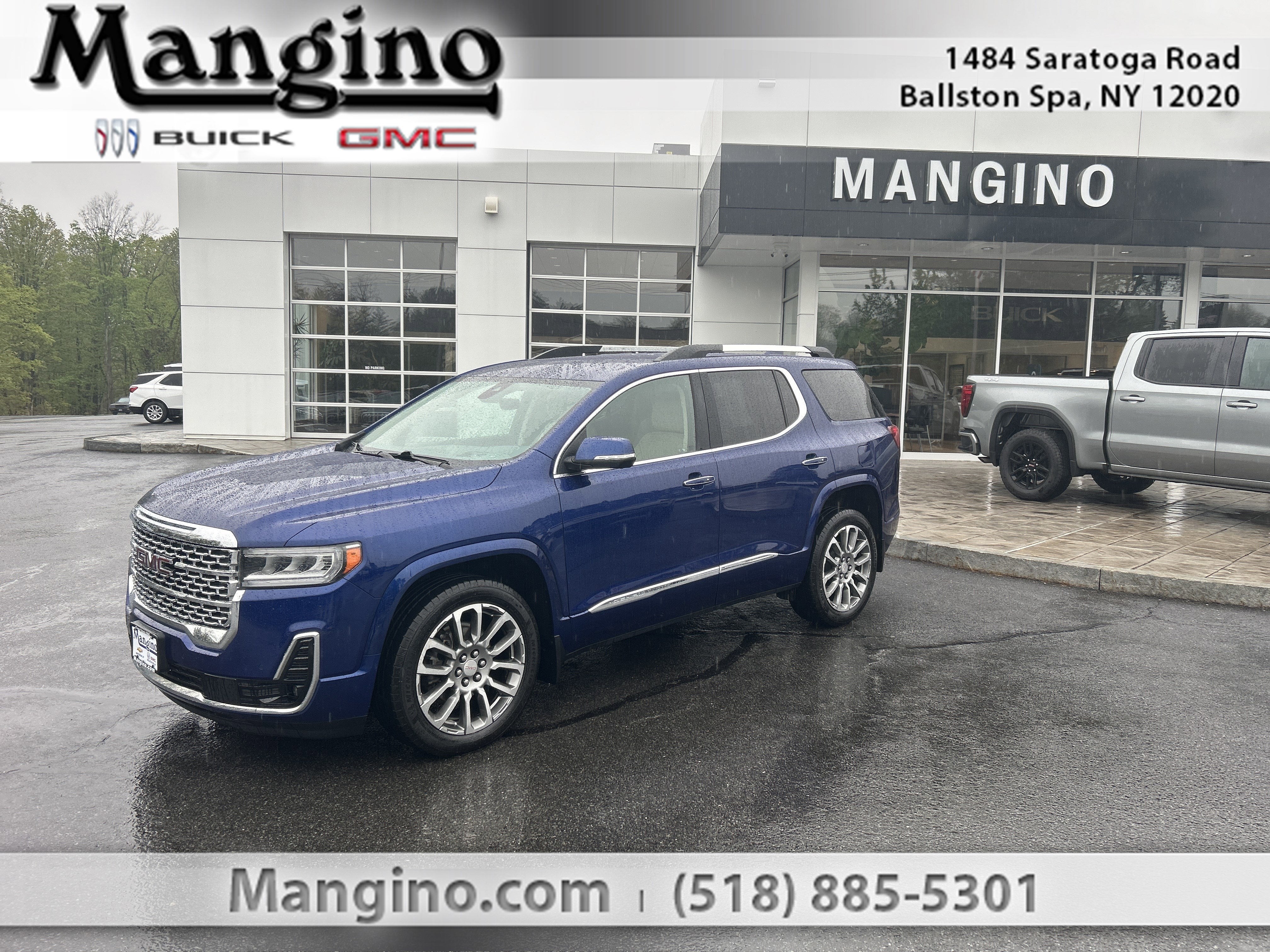 2023 GMC Acadia Denali in Ultra Blue Metallic — front three-quarter view