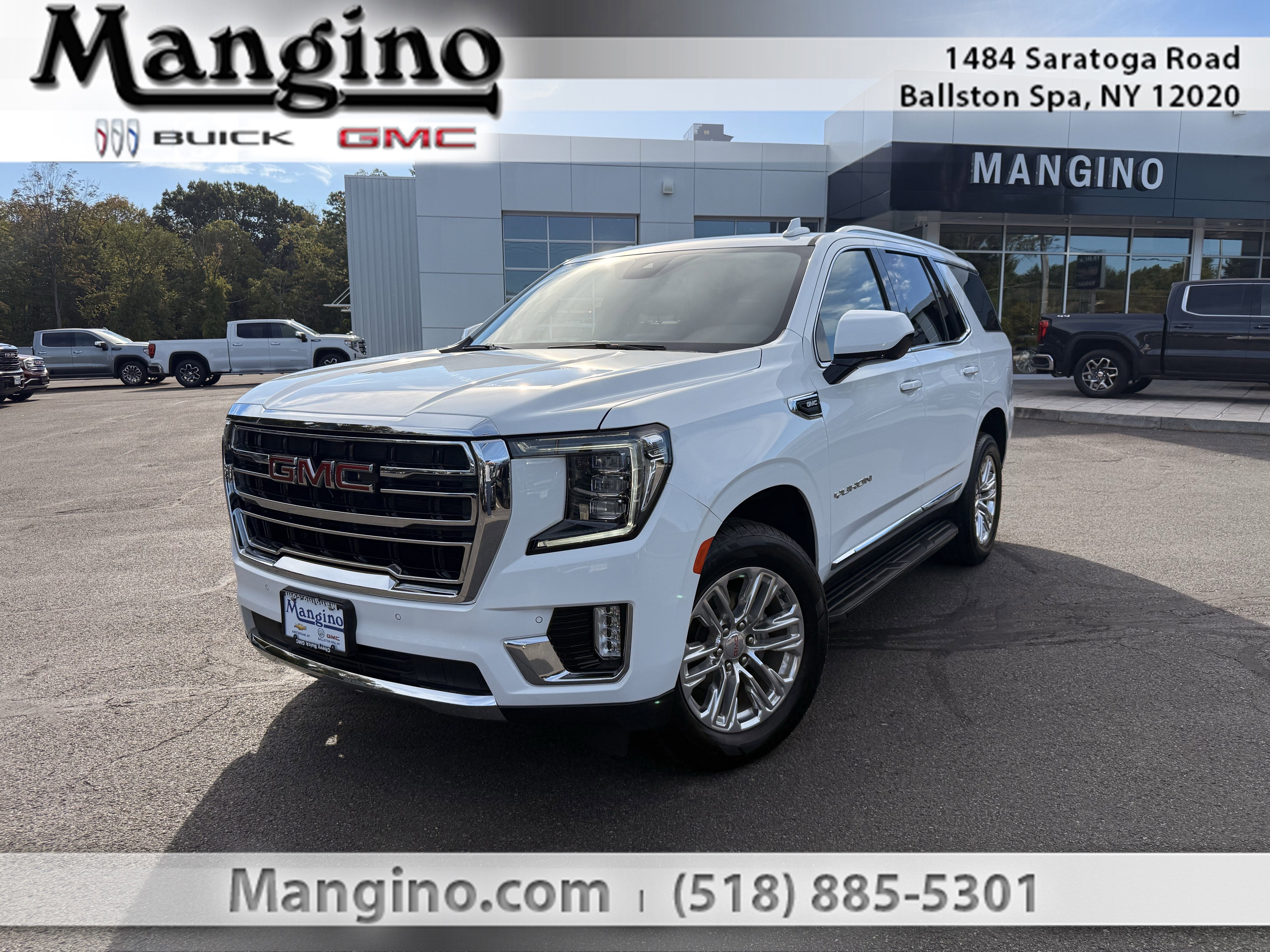 2024 GMC Yukon SLT in Summit White — front three-quarter view