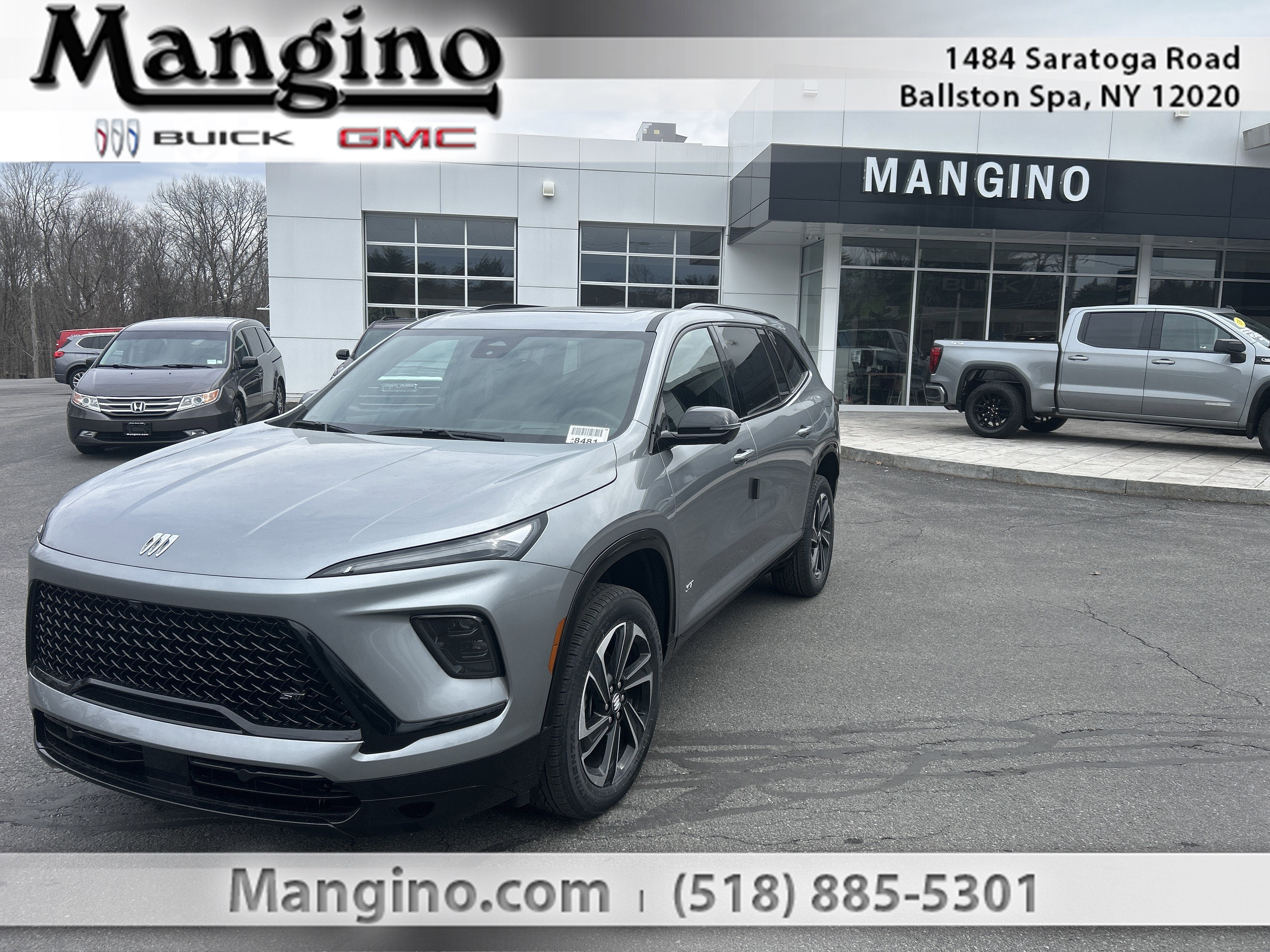 2026 Buick Enclave Sport Touring in Moonstone Gray Metallic — front three-quarter view